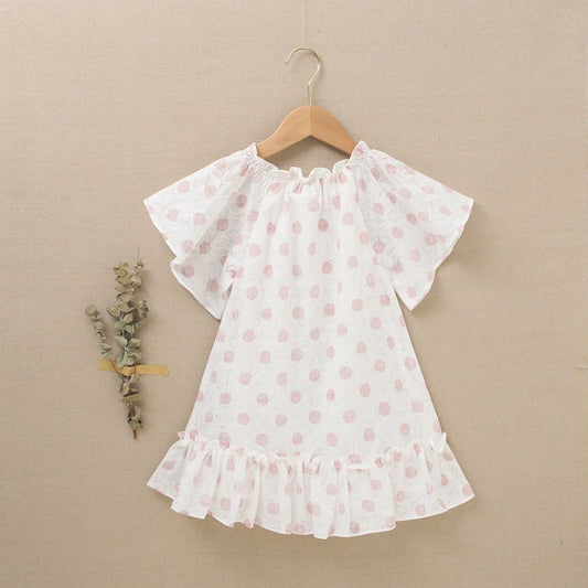 vestido de niña blanco con estampado en tonos rosas y volante inferior
