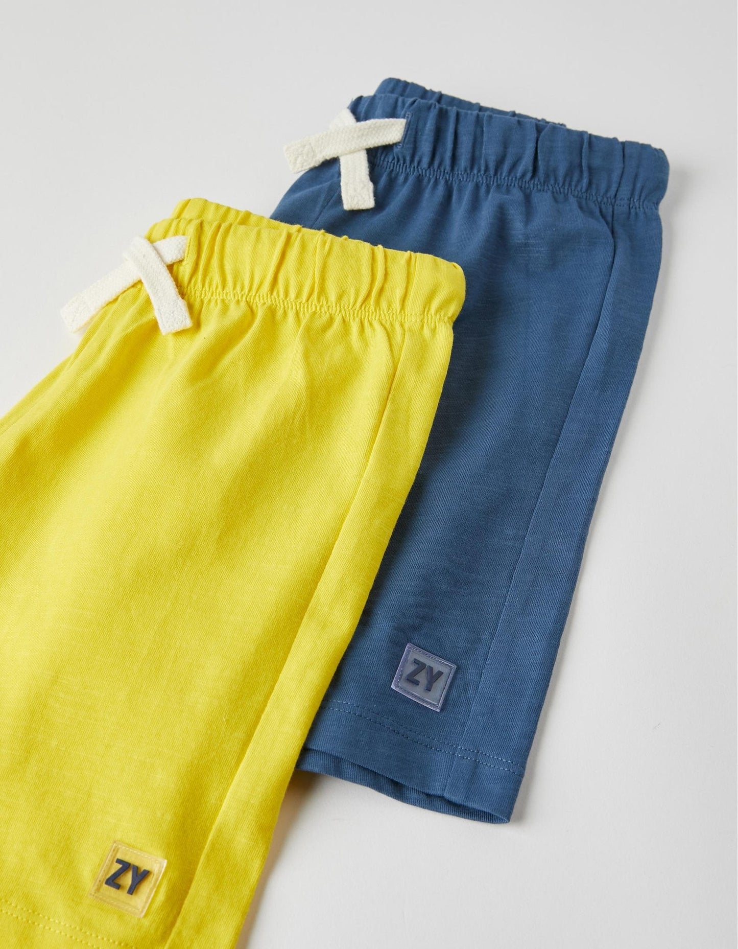 set dos shorts para niño azul y amarillo