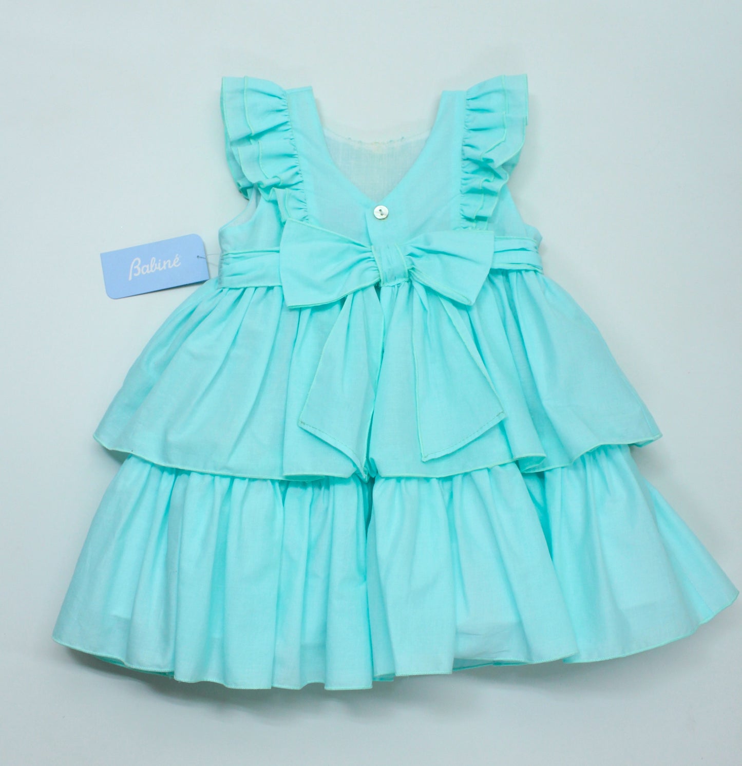 Vestido menta encaje en el pecho y dos olanes