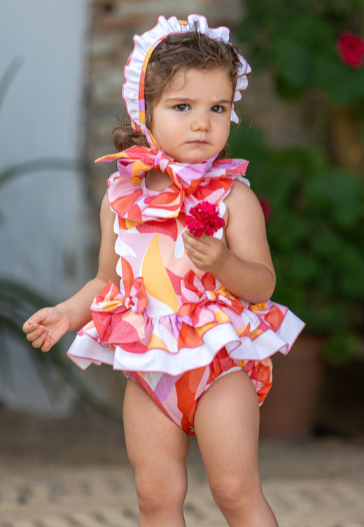 pelele completo con olan en cintura, colores rojos y naranjas