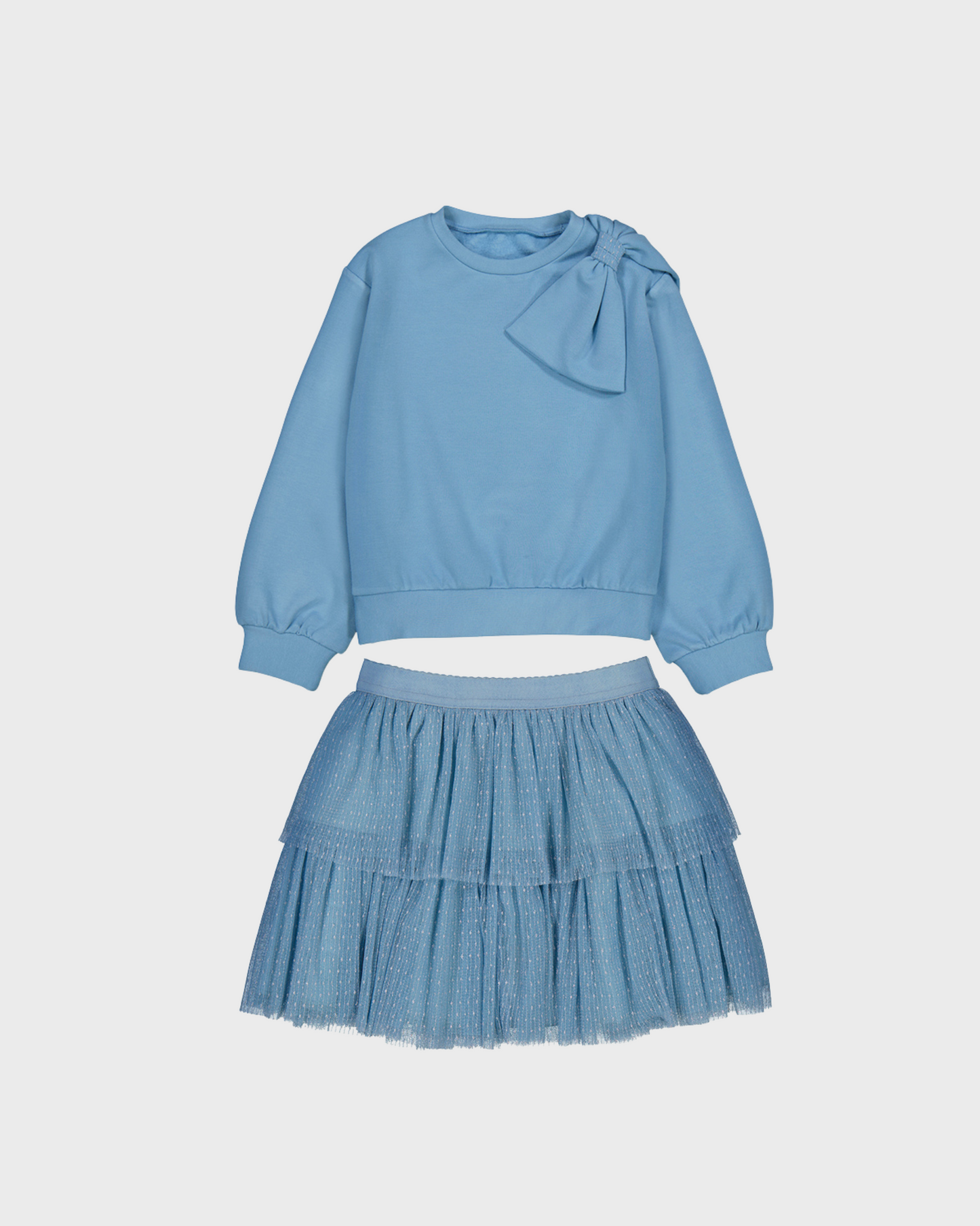 Conjunto jersey con moño en hombro y falda tul azul