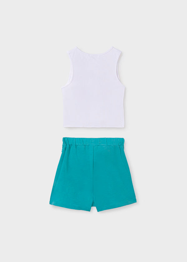 Conjunto falda pantalón y blusa blanca con argolla