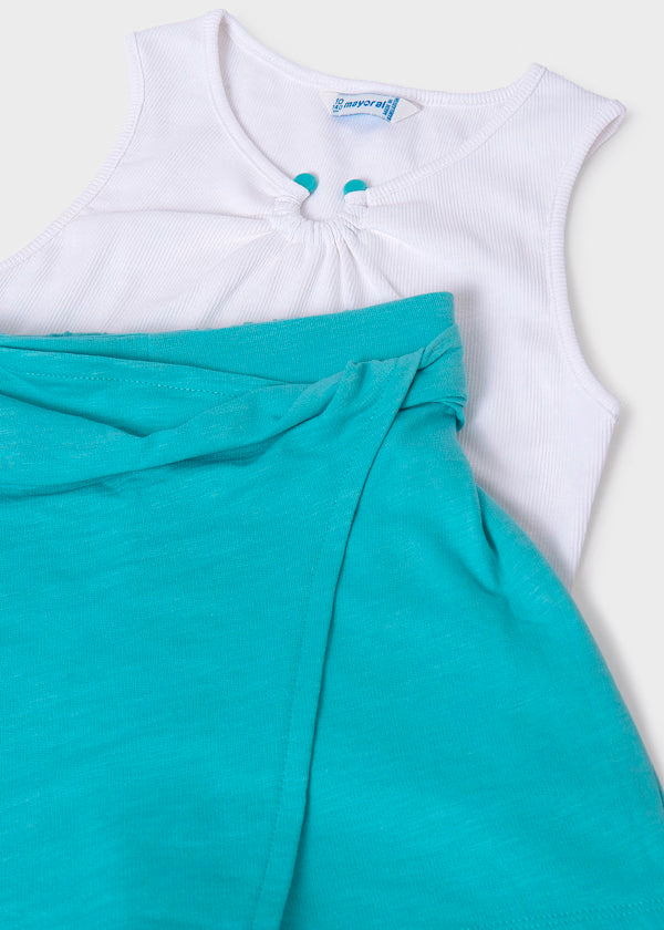 Conjunto falda pantalón y blusa blanca con argolla