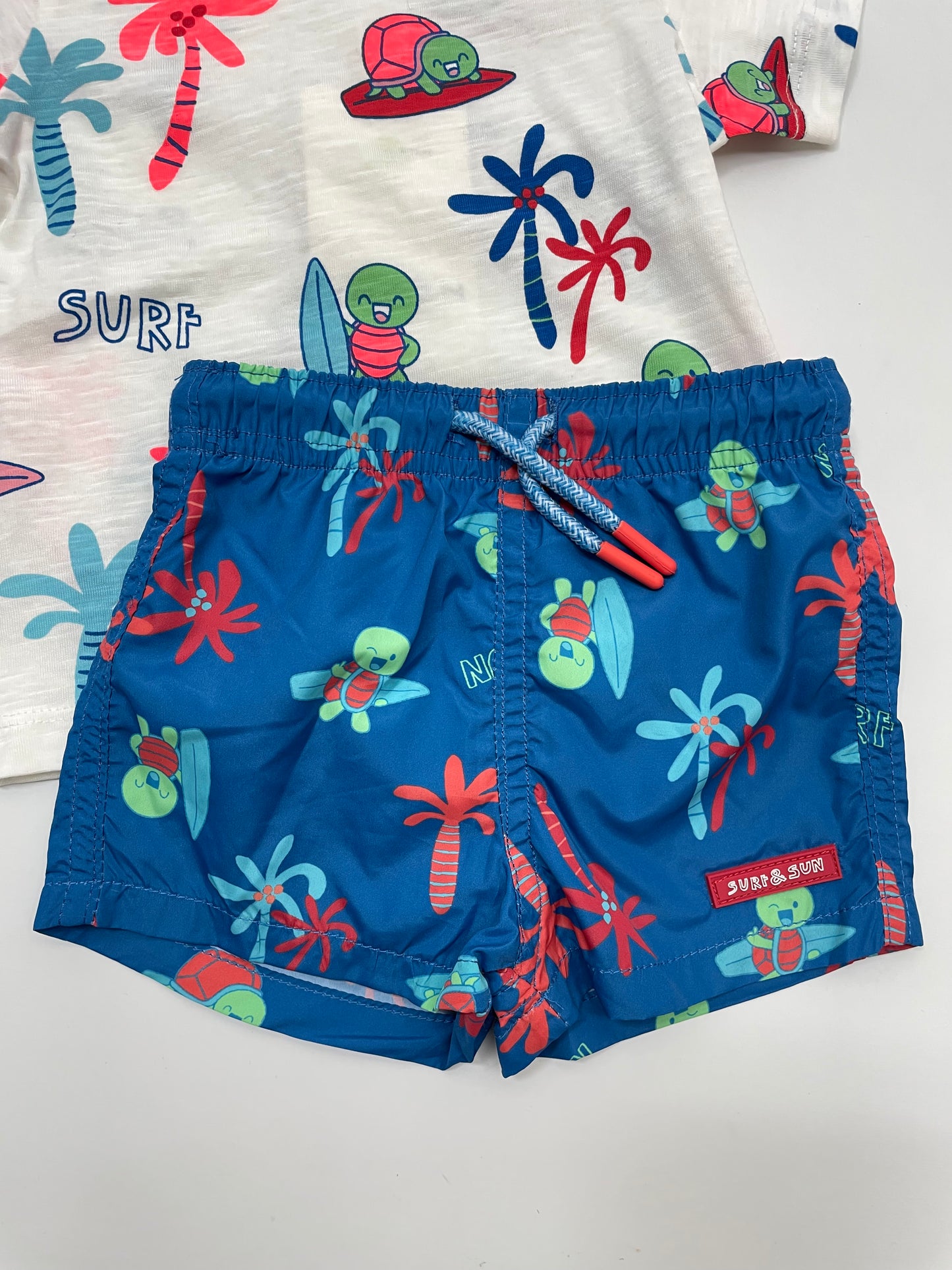 Traje de baño azul y blanco, bebe niño