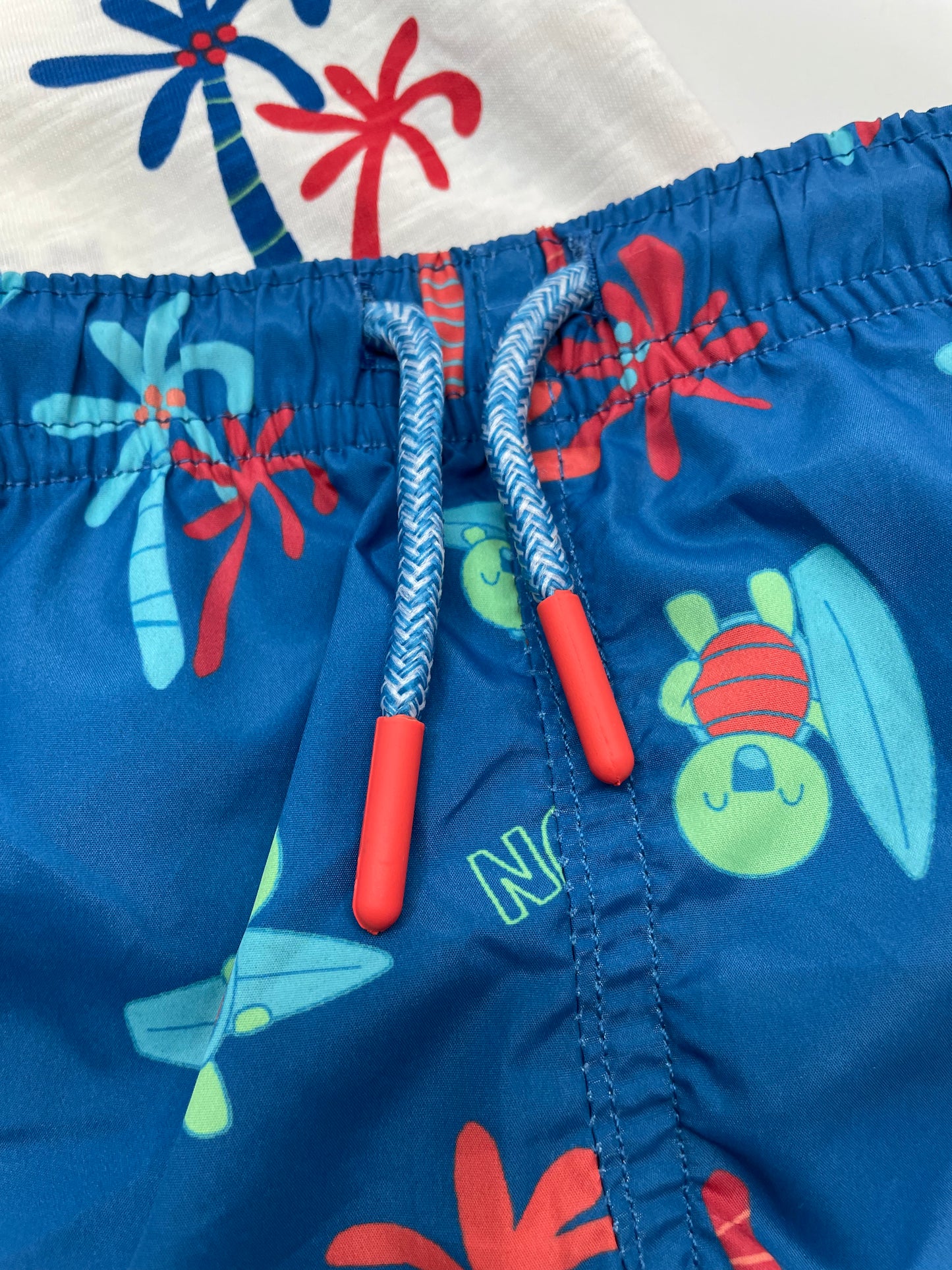 Traje de baño azul y blanco, bebe niño