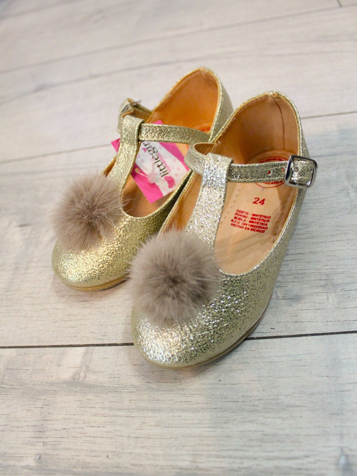 spañoletas oro con pompon, cierre con hebilla