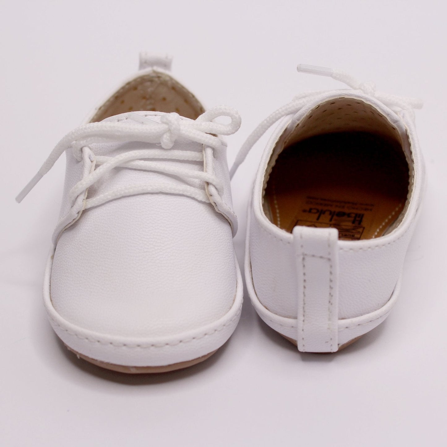 zapato bambino blanco, cordones.