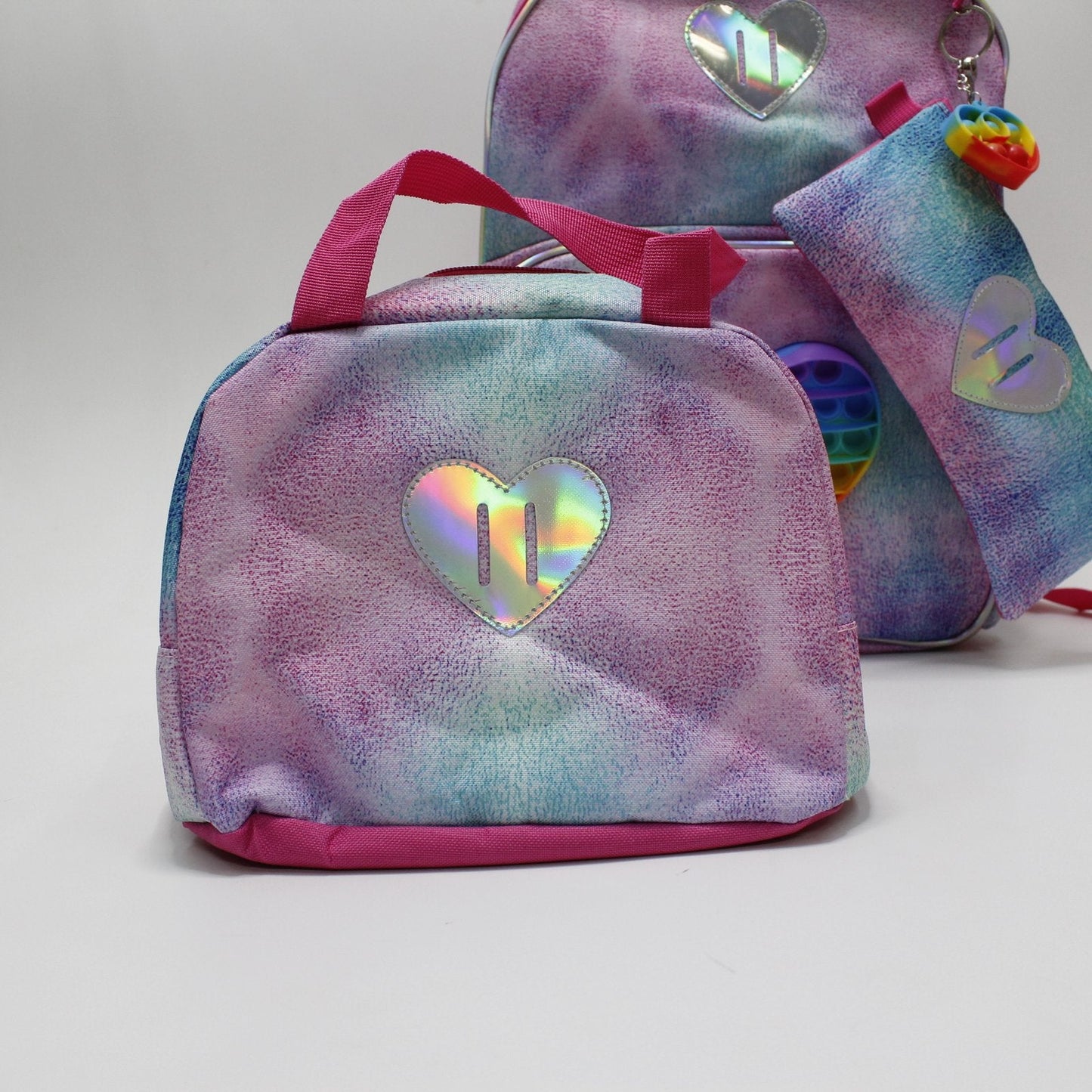 set mochila, lapicera y lonchera tema corazón popit holográfico