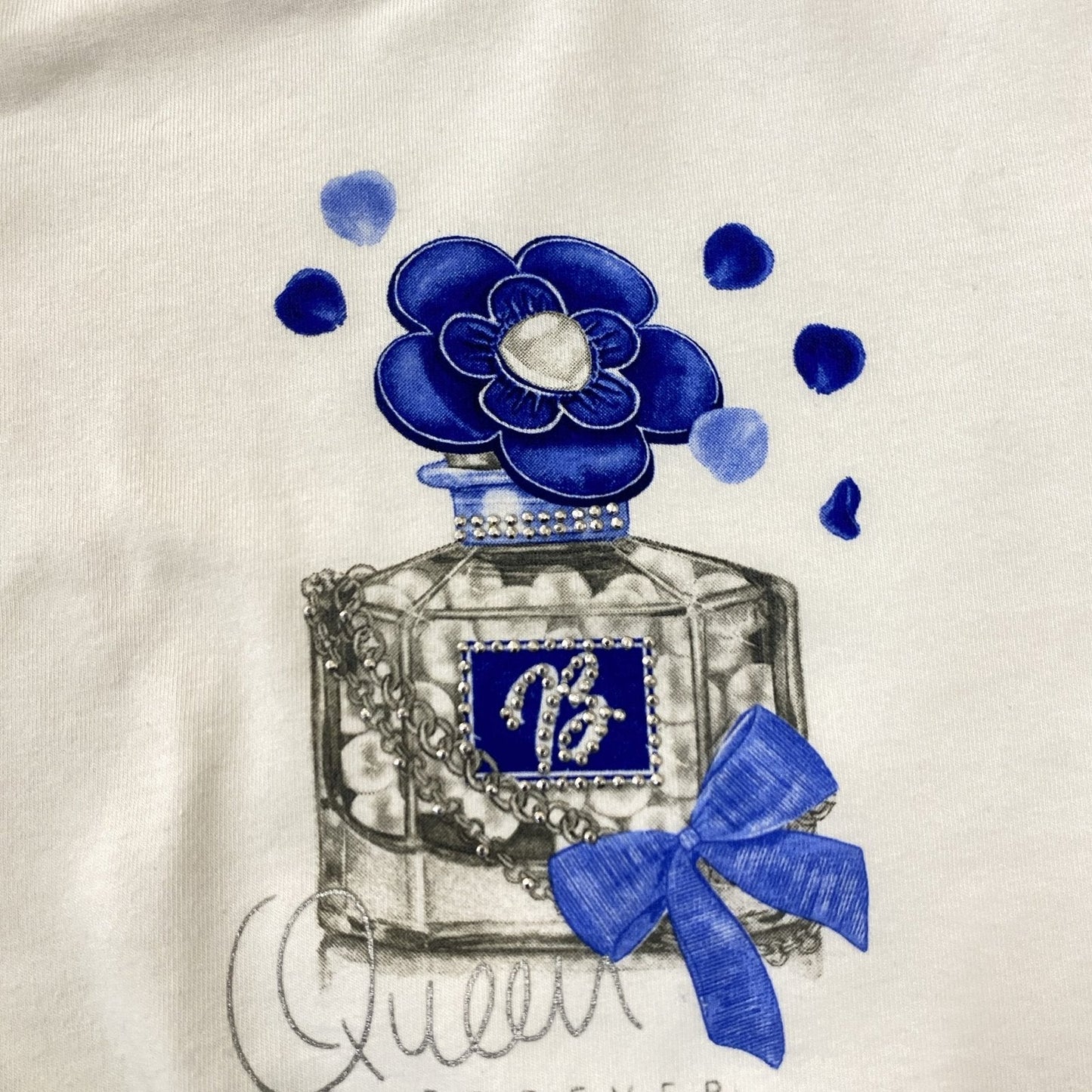 conjunto blusa blanca con perfume, falda flores