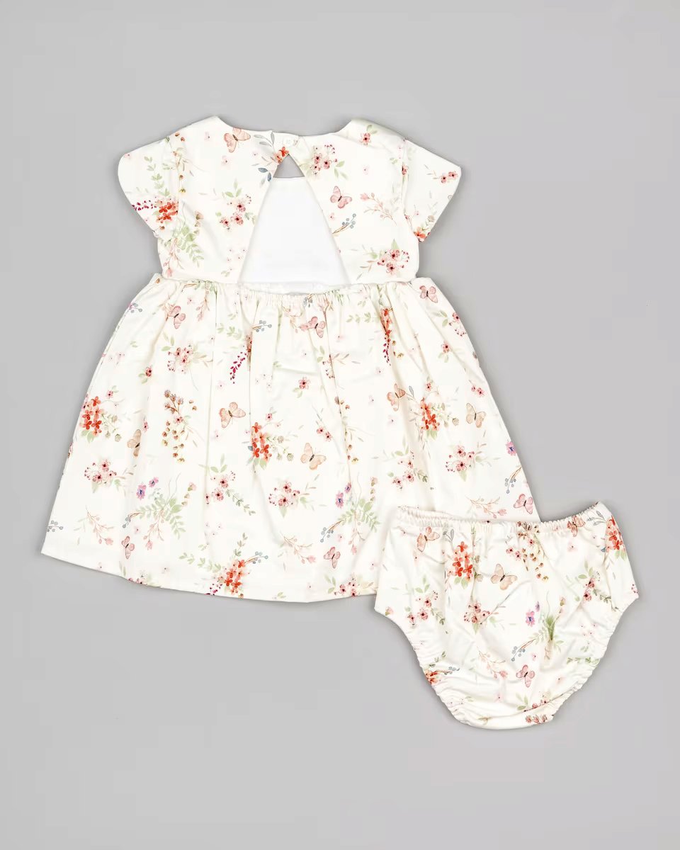 vestido color crema con flores naranjas, para bebé