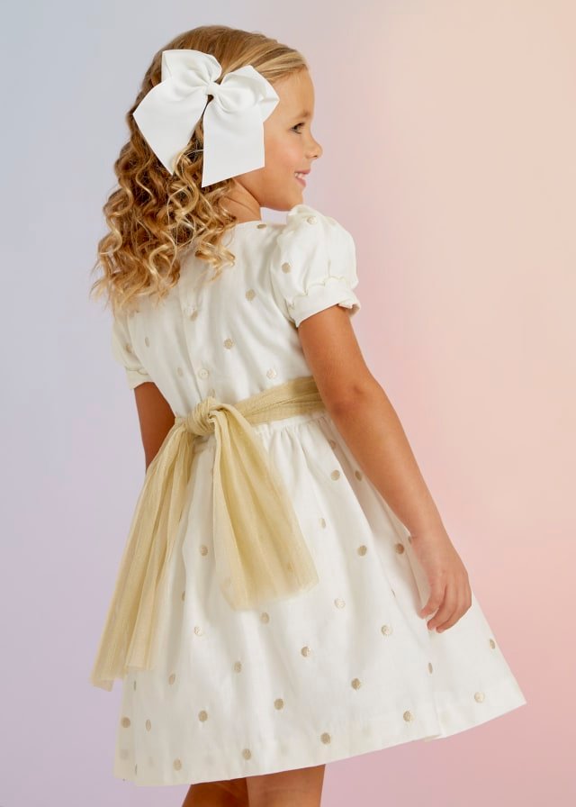 vestido de lino con lunares dorados para niña.