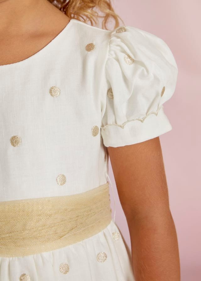 vestido de lino con lunares dorados para niña.