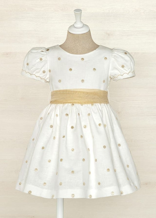 vestido de lino con lunares dorados para niña.