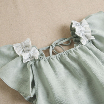 vestido de niña  verde olivo con volantes en contraste