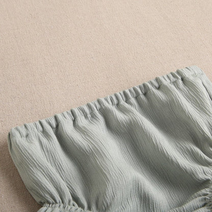 vestido de bebé niña con cubrepañal en bambula verde olivo con volantes en contraste