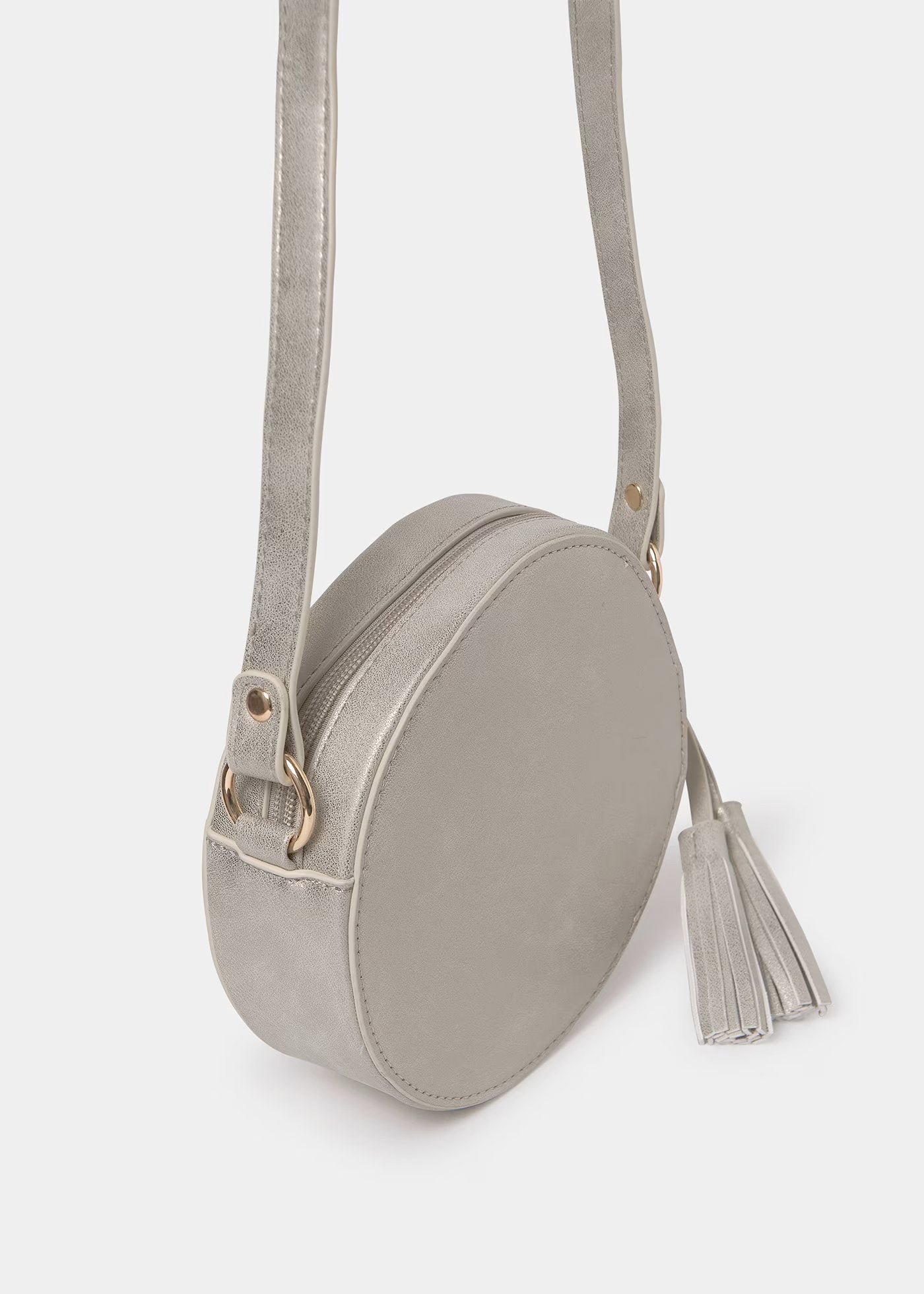 bolso redondo color champagne, mayoral