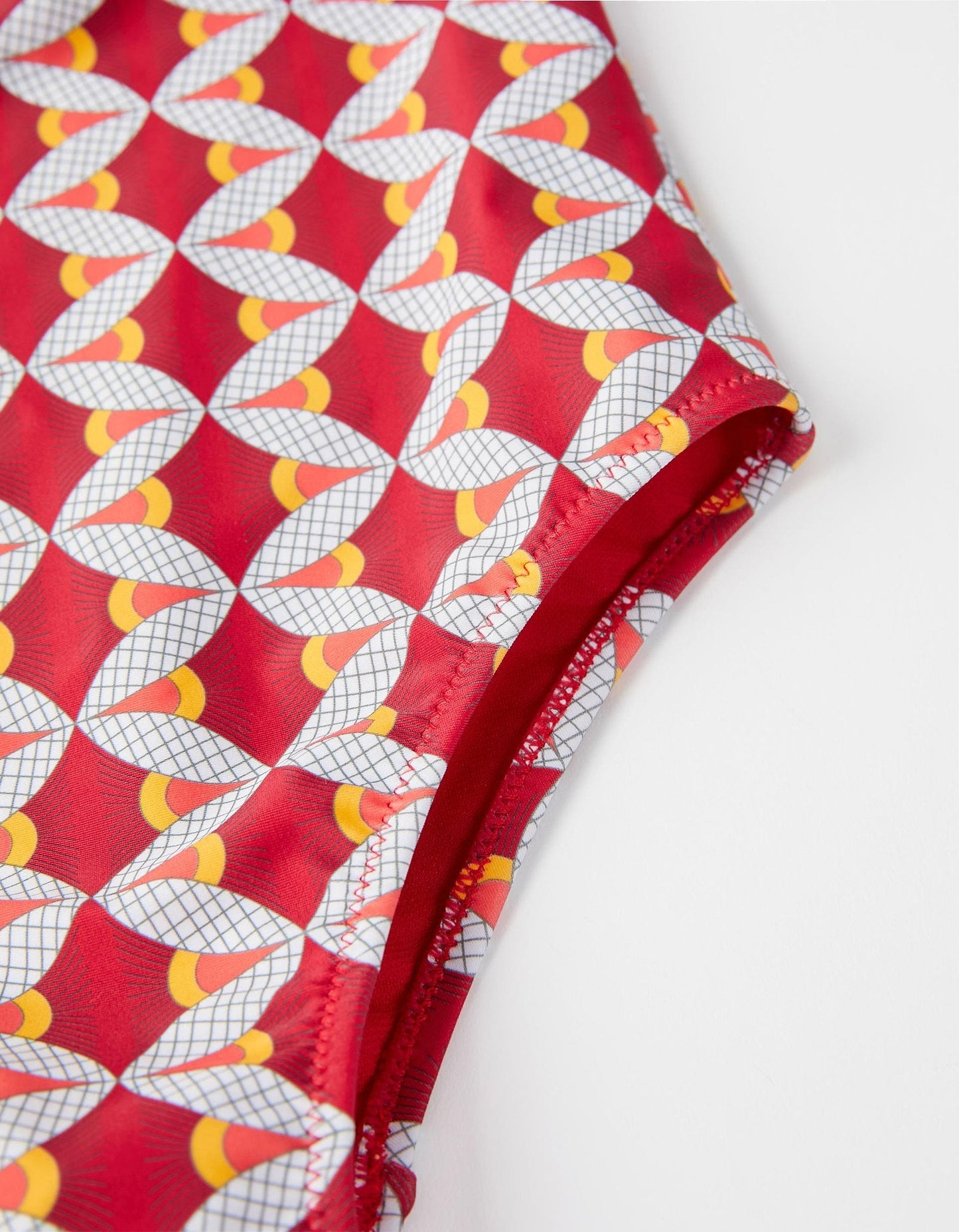 bañador rojo estampado olan con pompones