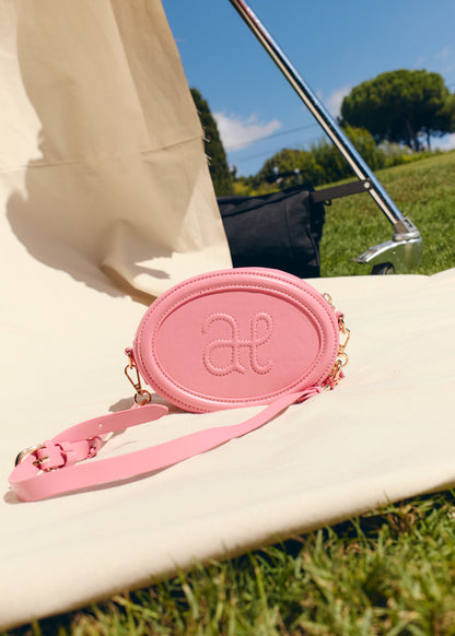 Bolso ovalado fucsia logo relieve