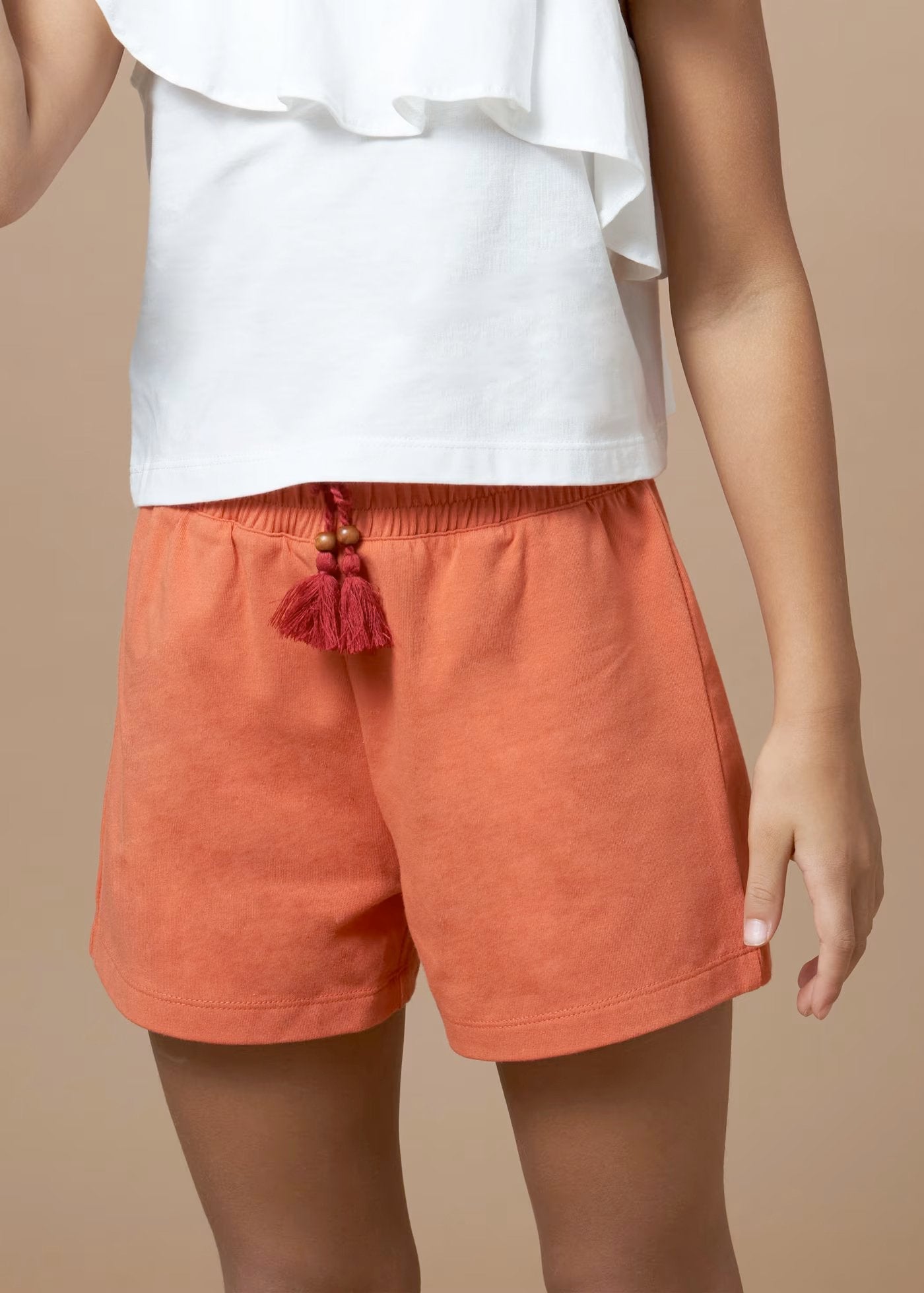 conjunto 2 piezas, blusa manga asimetrica, short naranja