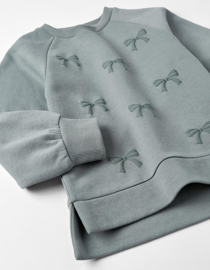 sudadera de algodón, cuello redondo, moños realce, color gris azulado