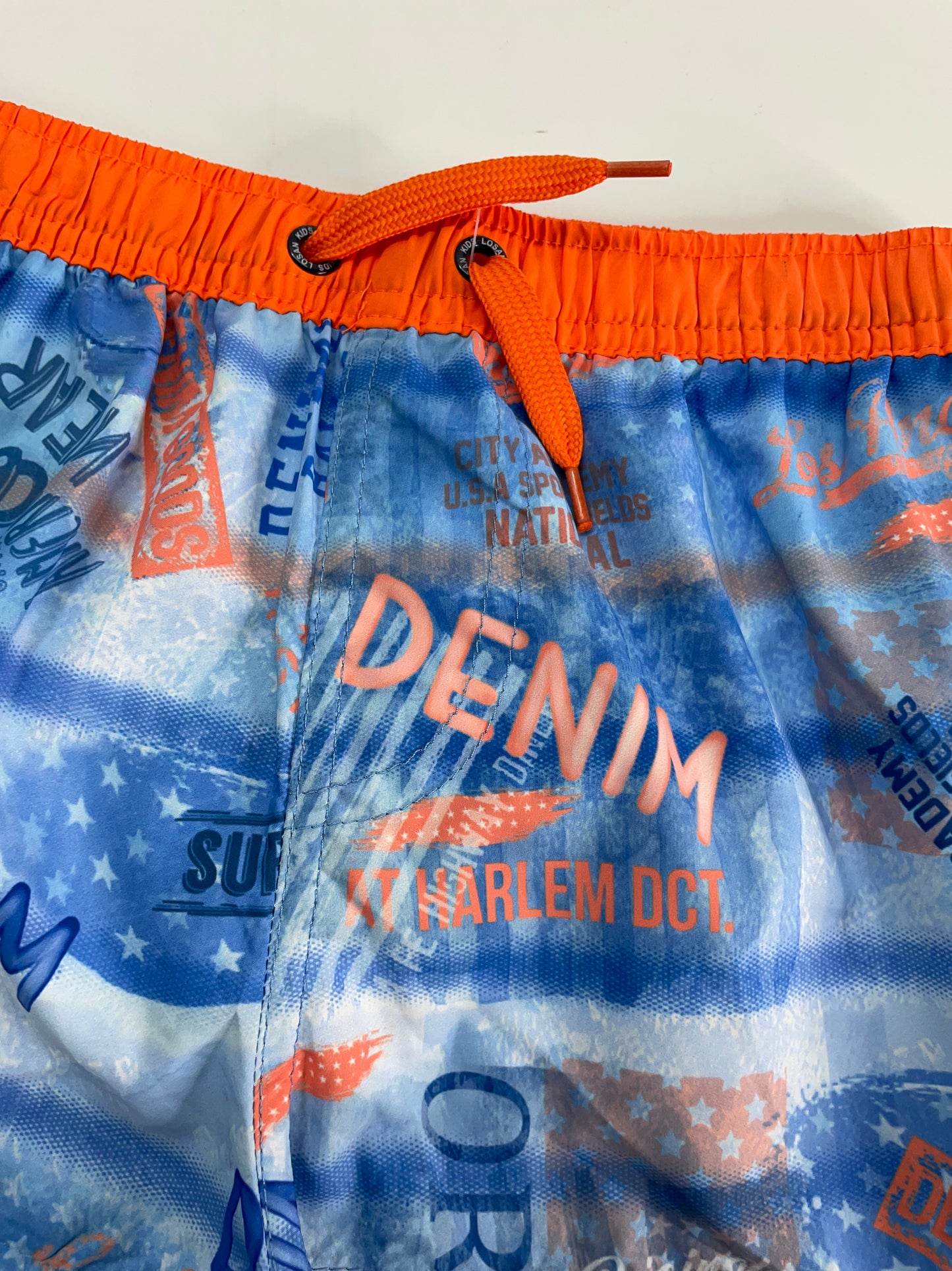 Bañador azul con elastico naranja