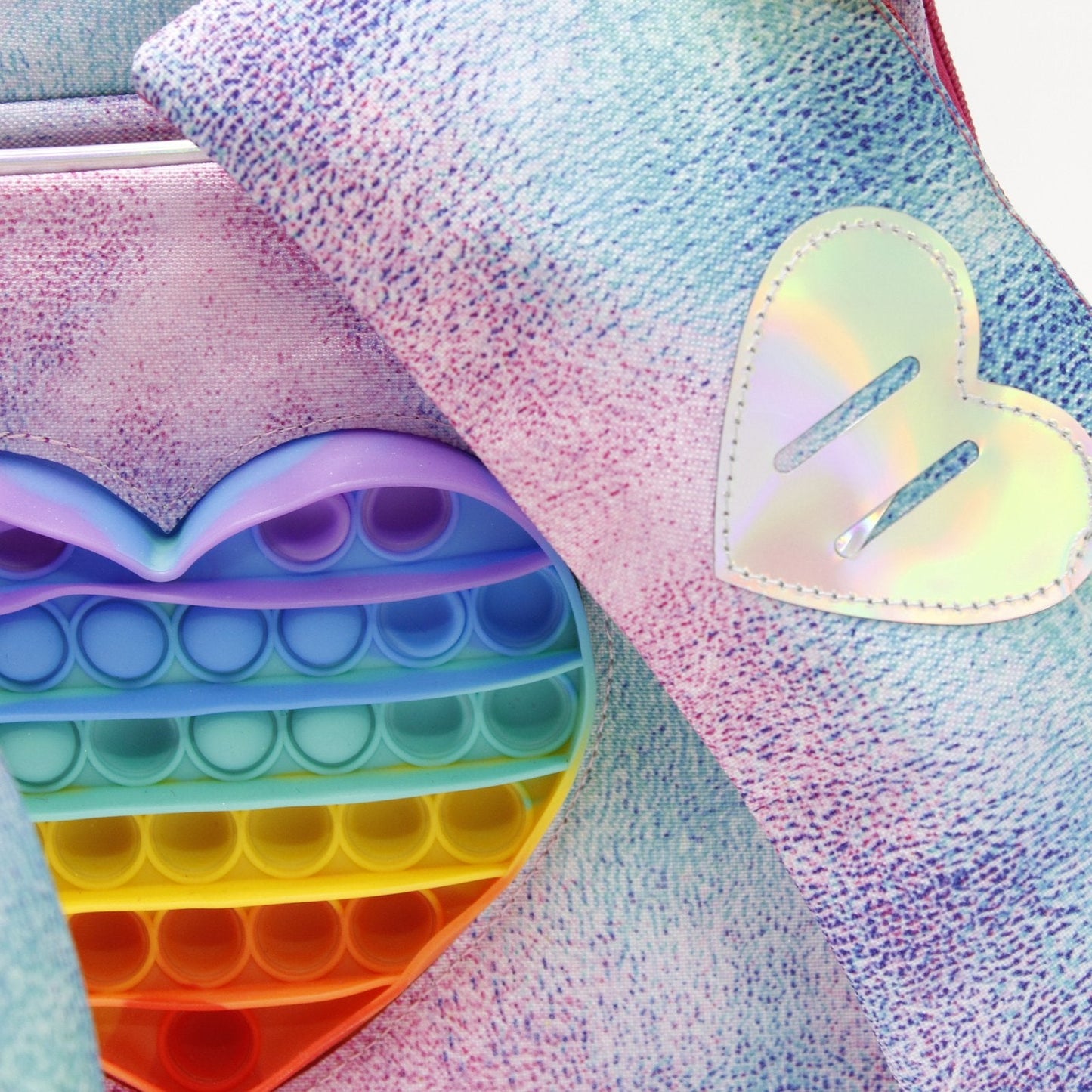 set mochila, lapicera y lonchera tema corazón popit holográfico