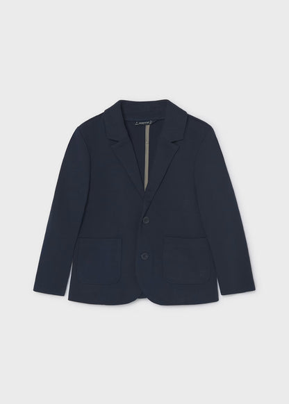 Chaqueta para niño. Bolsillos delanteros. Botones en la parte delantera.