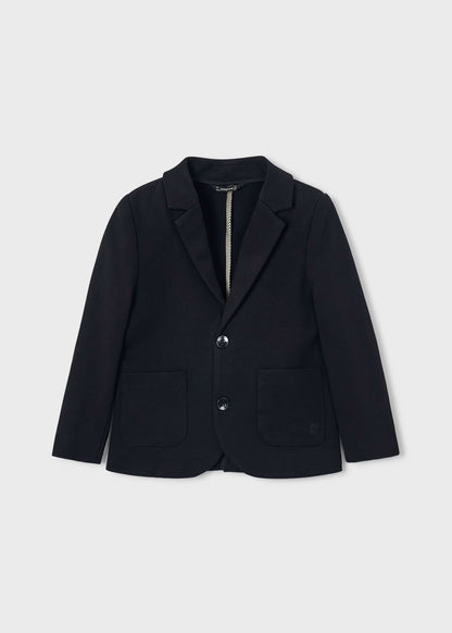 Chaqueta para niño. Bolsillos delanteros. Botones en la parte delantera.