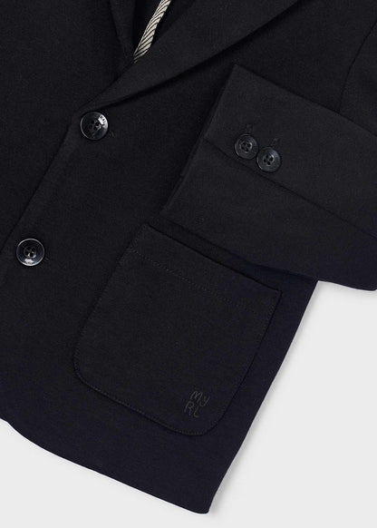 Chaqueta para niño. Bolsillos delanteros. Botones en la parte delantera.