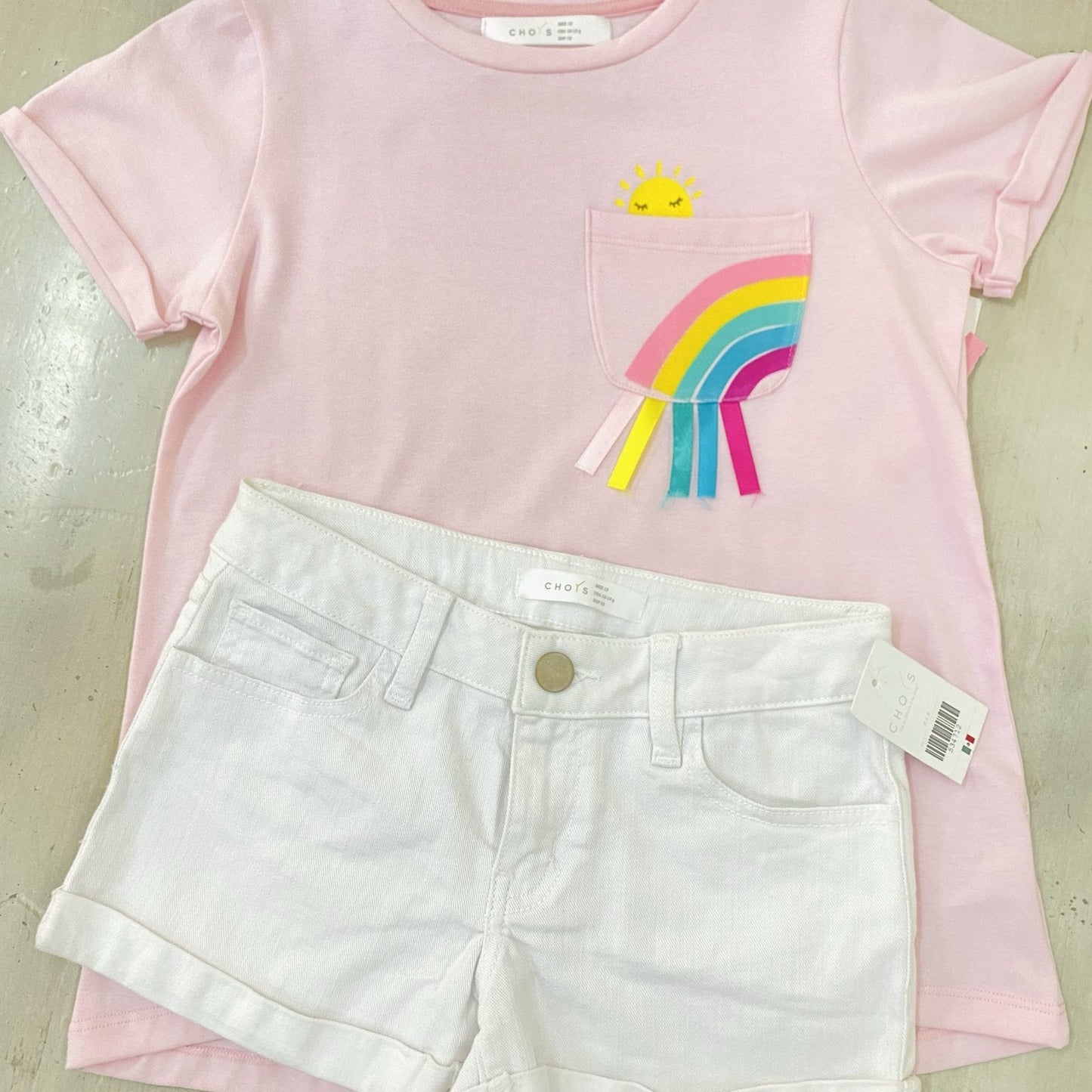 Set blusa rosa sol arcoiris, short blanco