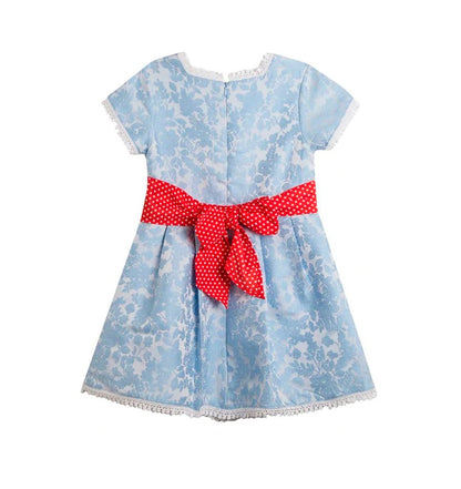 vestido azul con moño rojo en la parte de atrás