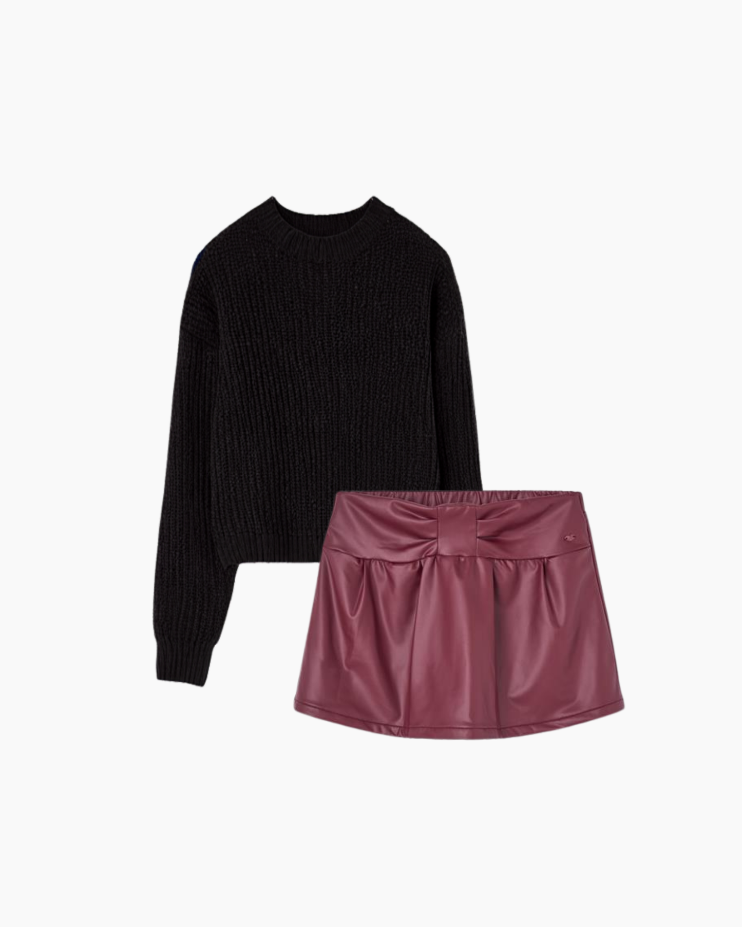 Conjunto sweater negro y falda polipiel vino